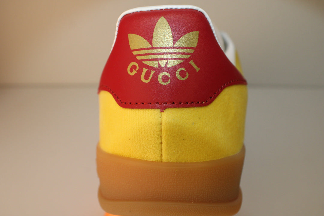 Red and Yellow Designar Adidas