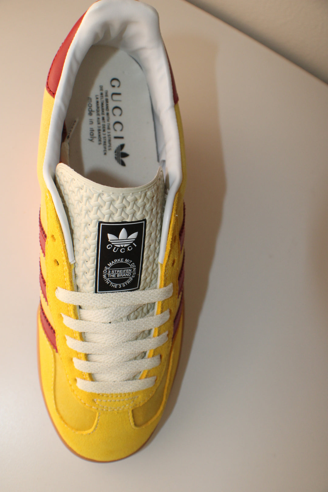 Red and Yellow Designar Adidas