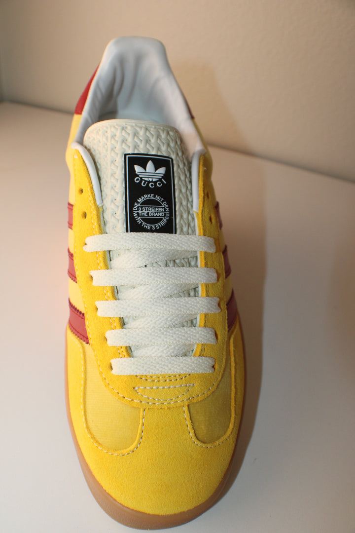Red and Yellow Designar Adidas